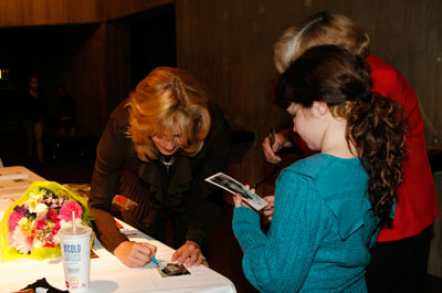 Karen Sharp signs autographs after the performance.